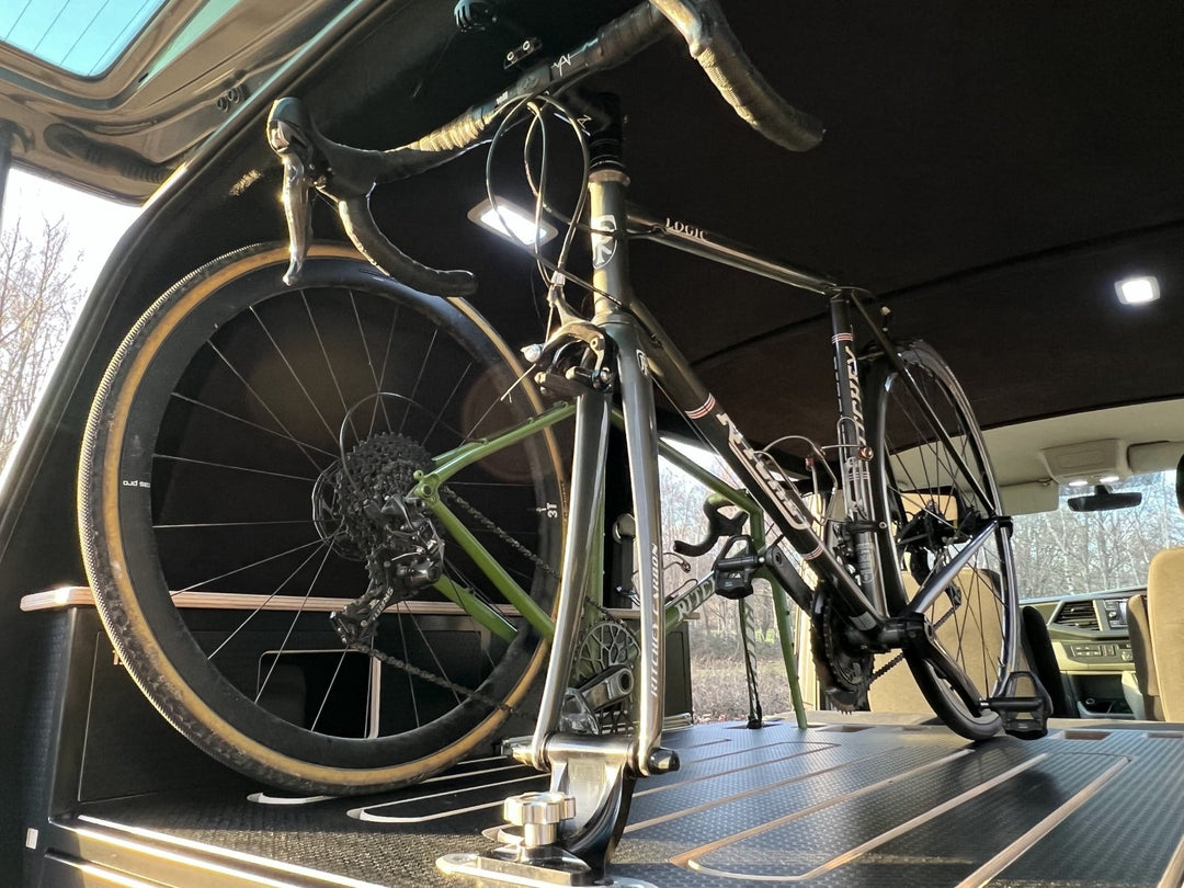 bikes in a van supported by a bracket from loaded bikes